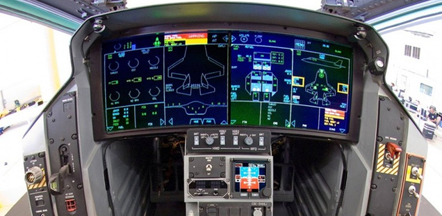 Not a steam gauge in sight. The cockpit of the F-35 features huge flat screens, and doesn’t even include a compass. In the event of power loss, batteries will power the screens long enough for the pilot to make an emergency landing. (Lockheed Martin)